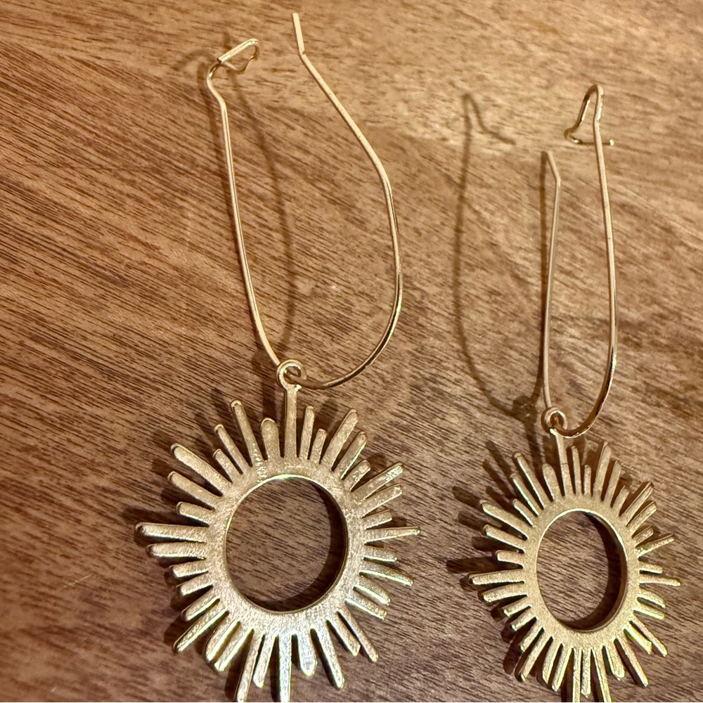 Gold colored sun earrings